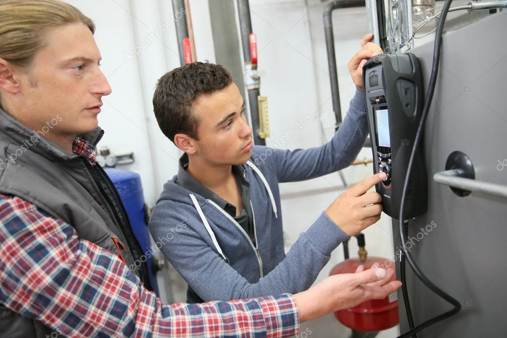 depositphotos_79359890-stock-photo-man-measuring-heat-pump-temperature